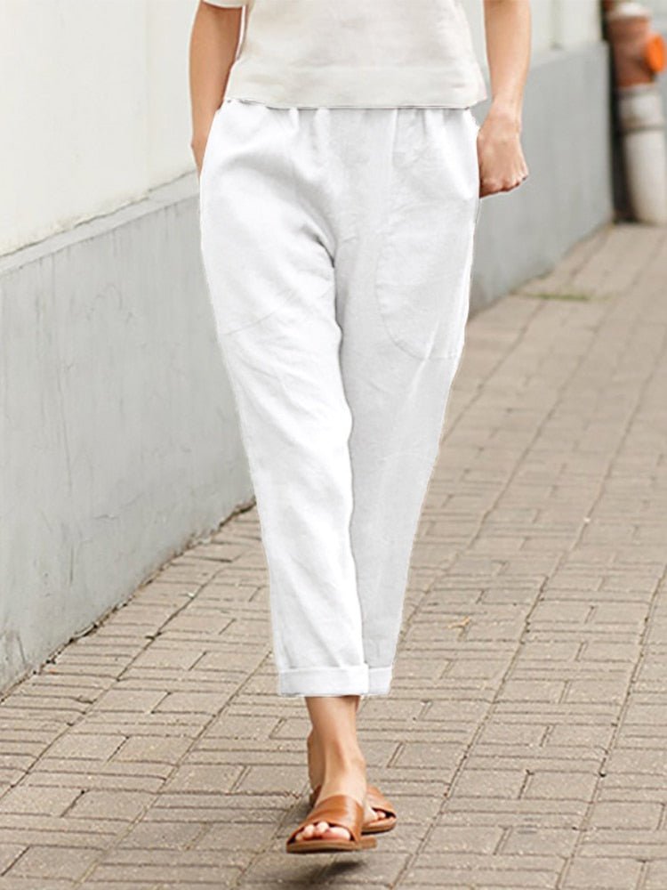 White Dayanara trousers worn with sandals.