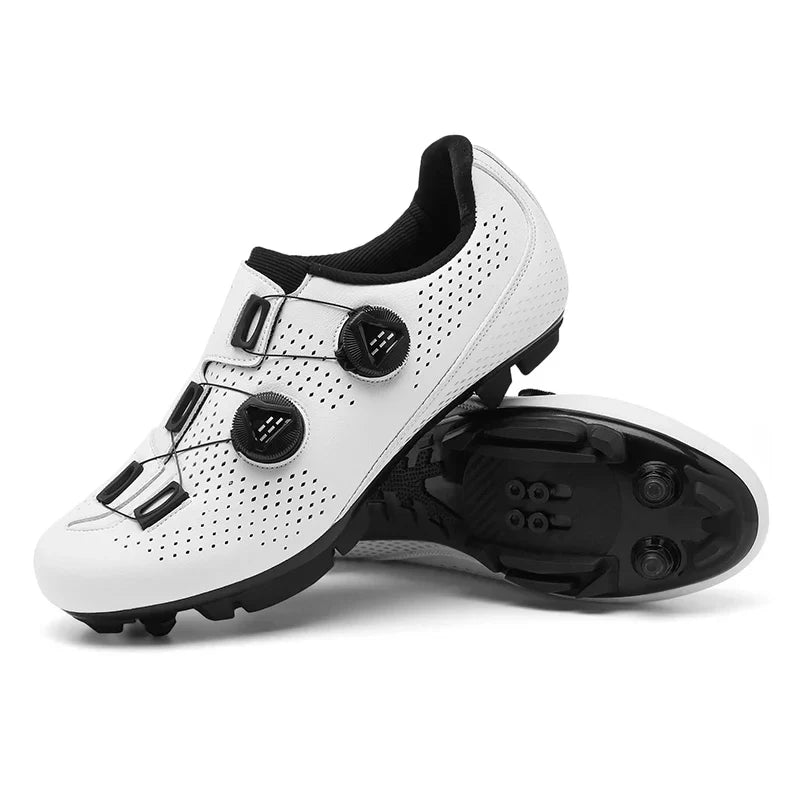 White cycling shoes with a lugged sole and mounting openings.