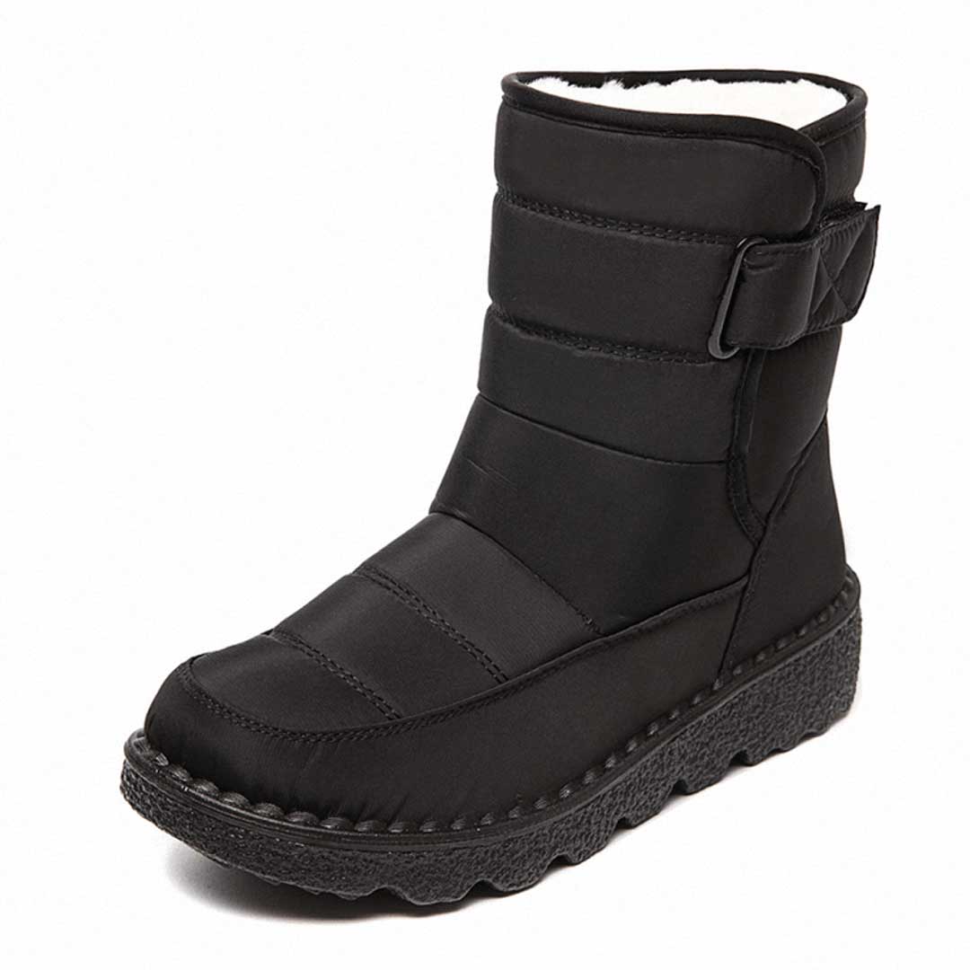 Black winter boot with a light lining and broad upper strap.