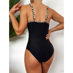 Rear view of a black swimsuit with leopard-print shoulder straps.