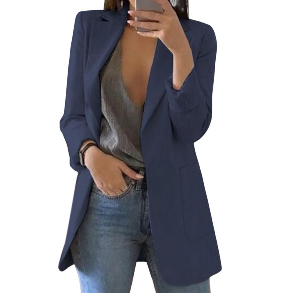 Navy blue long open-front blazer worn with jeans.