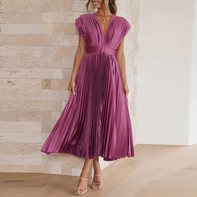 Purple pleated dress with a deep V-neckline.