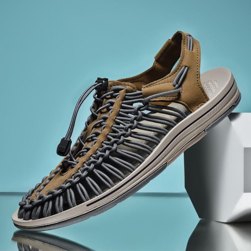 Khaki and grey cord sandal with toggle laces and open sides.