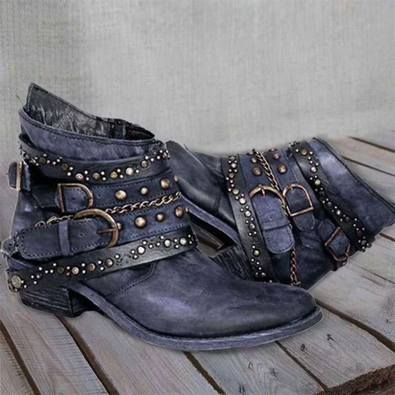 Blue ankle boots with buckled ankle straps and decorative chains.