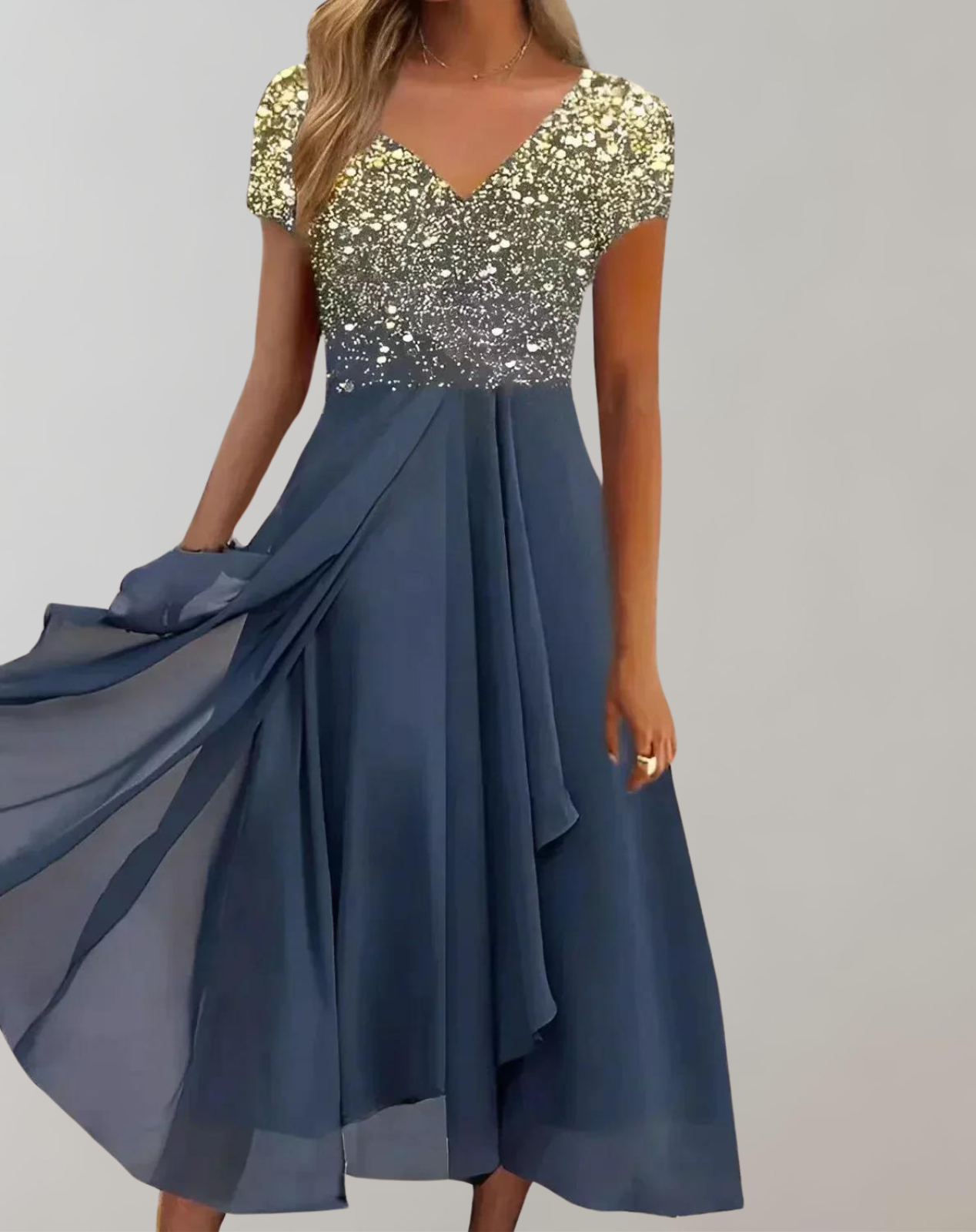 Gold sparkling V-neck top with a flowing blue skirt.
