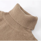 Close-up of the ribbed roll neck on a taupe sweater.