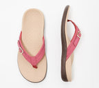 Pink flip-flops with pale footbeds and buckle details.