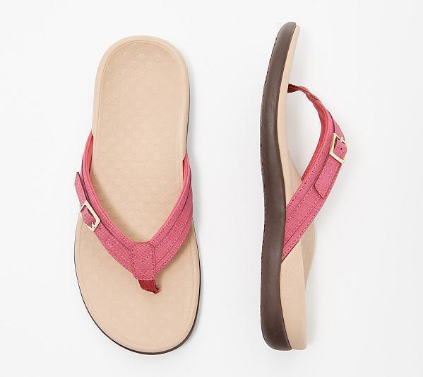 Pink flip-flops with pale footbeds and buckle details.