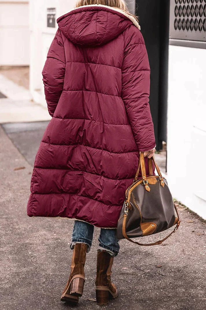 Rear view of the wine-red quilted coat and hood.
