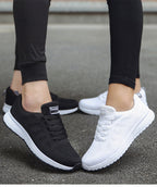Black and white trainers shown together.