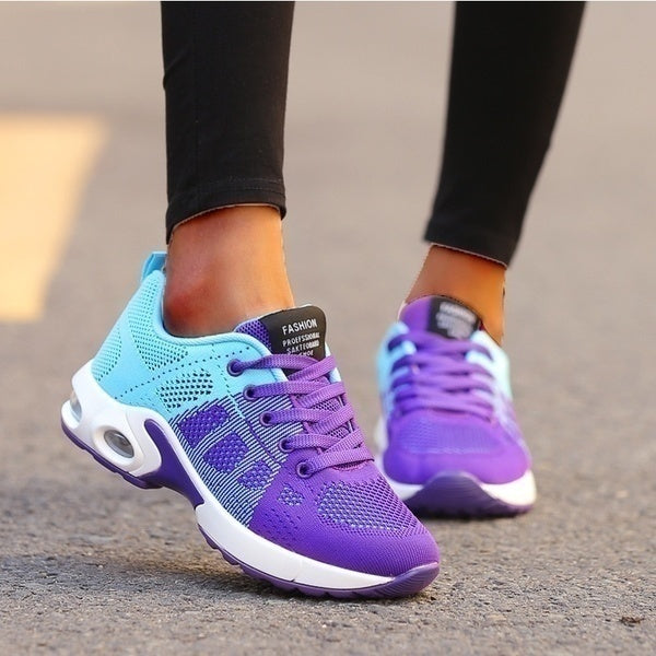 Light-blue and purple trainers with contrasting purple laces.