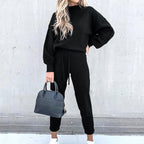 Black lounge set with a high neckline and elastic cuffs.