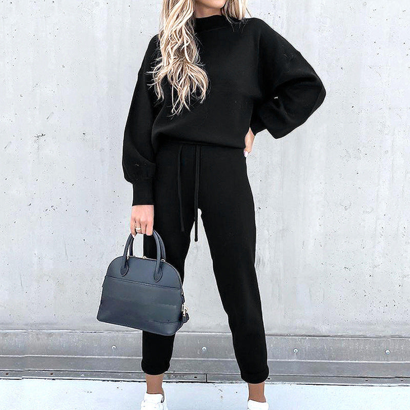 Black lounge set with a high neckline and elastic cuffs.