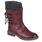 Red boot with a dark grey knit cuff, dark laces and a low heel.