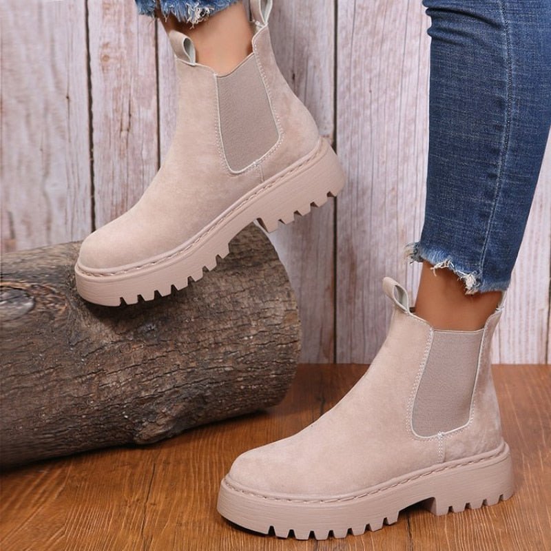 Side view of Apricot Hidar boots showing rounded toes and pull tabs.