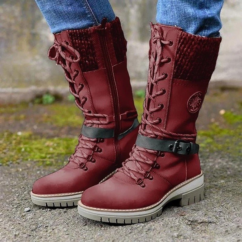 Red tall boots with laces and dark ankle straps.