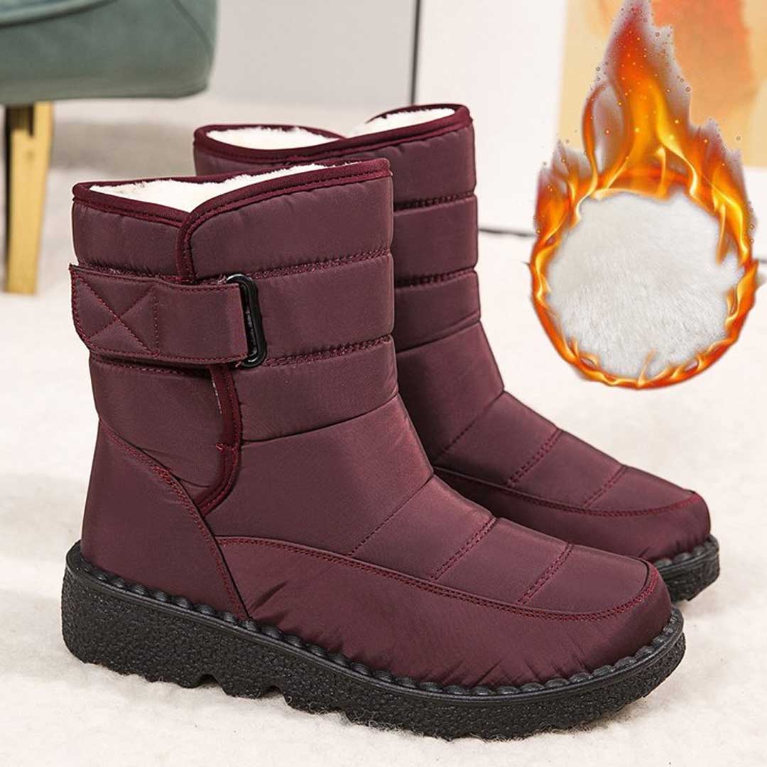 Red lined winter boots beside an existing source flame graphic surrounding a lining detail.