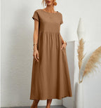 Brown Ginovu dress with a round neckline and short sleeves.