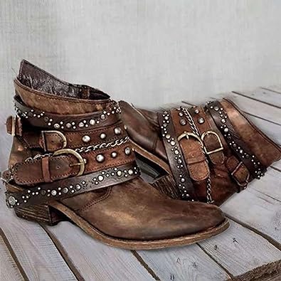 Brown vintage ankle boots with layered buckle straps, studs and chain accents.