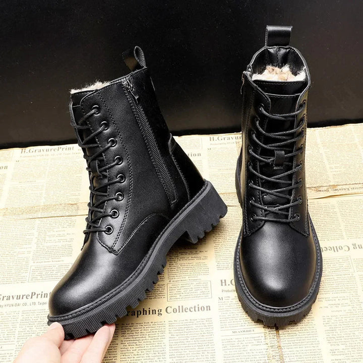 Black lace-up boots showing a side zip, rear pull tab and textured sole.
