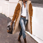 Brown long quilted jacket shown open with a pale textured inside.