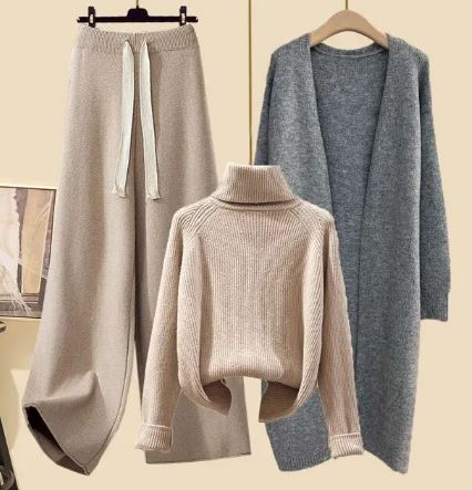 Beige roll-neck jumper and trousers displayed with a grey long jacket.