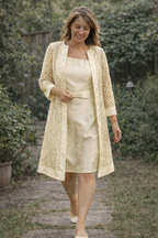 Champagne dress and matching three-quarter-sleeve jacket.