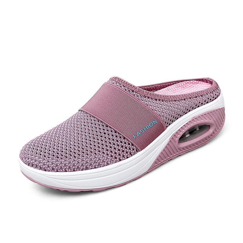 Pink mesh mule with a wide front band and open heel.