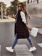 Black quilted gilet shown while walking.