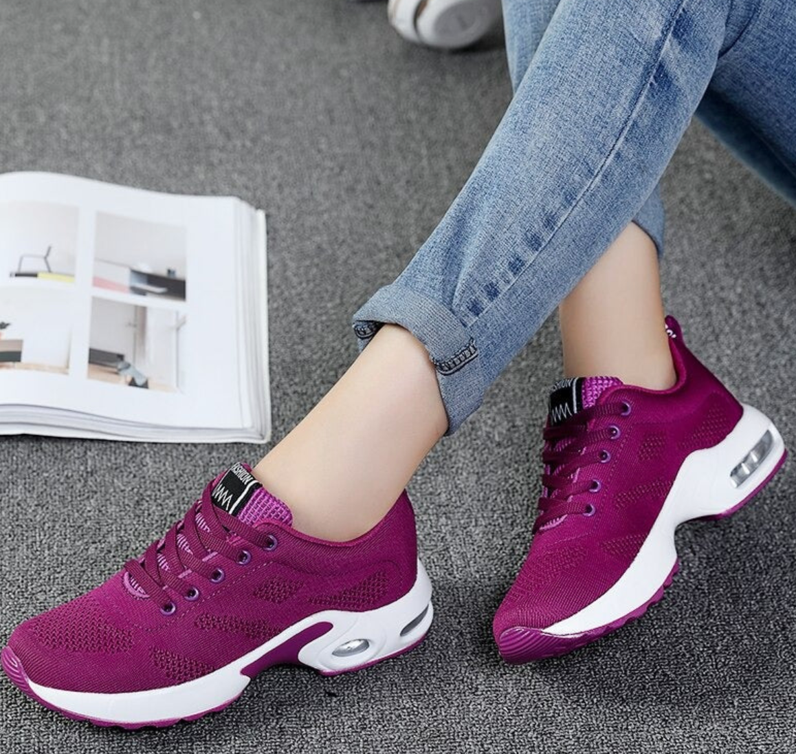 Purple mesh trainers with white curved sole panels.
