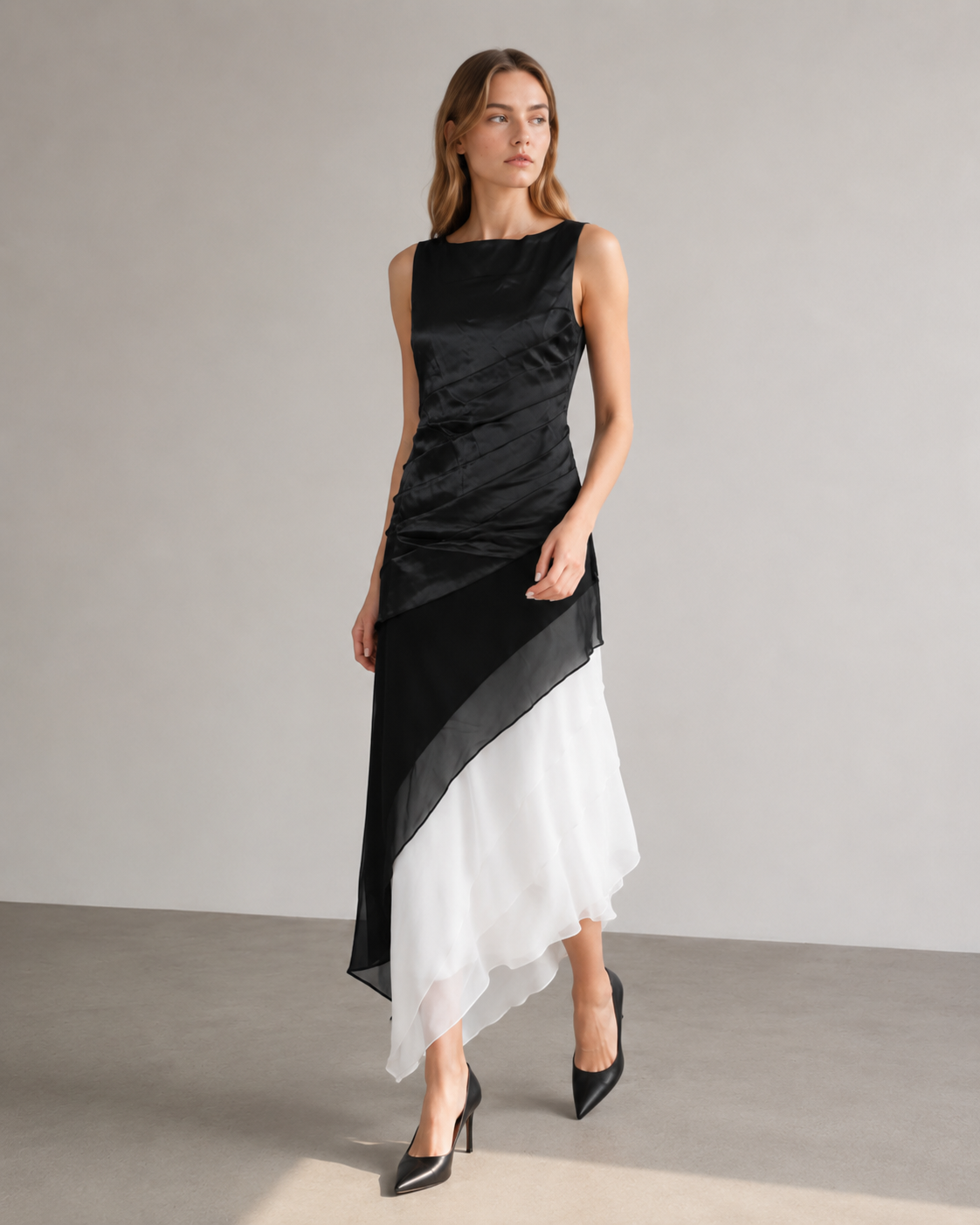 Sleeveless dress with a high round neckline and overlapping diagonal skirt panels.