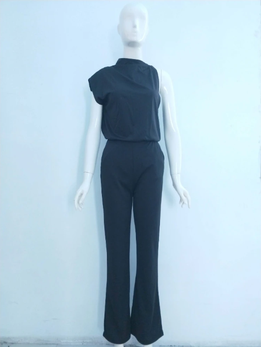 Dark jumpsuit on a mannequin showing its draped neckline and defined waist.