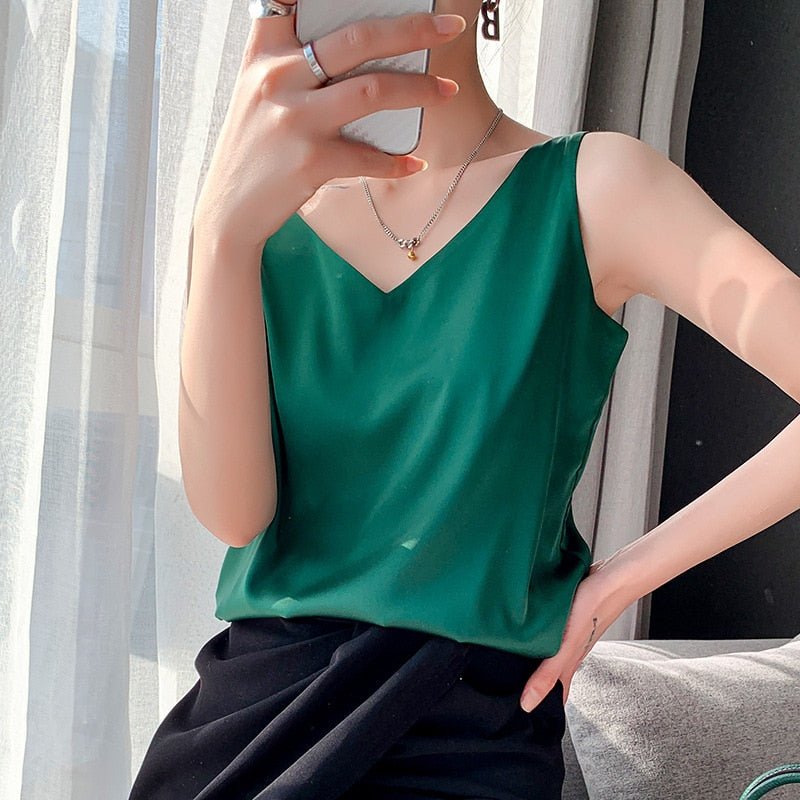 Emerald green V-neck tank top with a smooth drape.