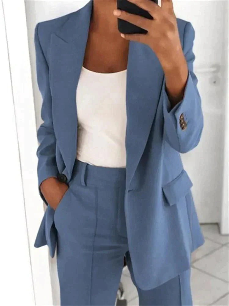 Light blue lapel jacket showing the front flap pocket and sleeve cuff.