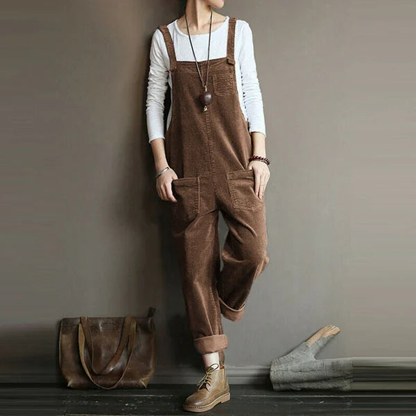 Coffee-brown corduroy dungarees worn over a white top.