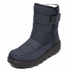 Blue winter boot with stitched panels and a dark textured sole.