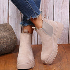 Apricot ankle boots with elastic side panels and chunky soles.