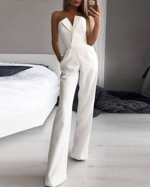 White strapless jumpsuit with front waist pleats and side pockets.