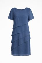 Blue short-sleeve dress with diagonal chiffon layers displayed on a pale background.