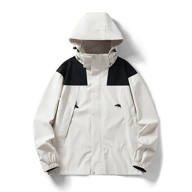 Pale beige jacket with black shoulder panels and a high collar.