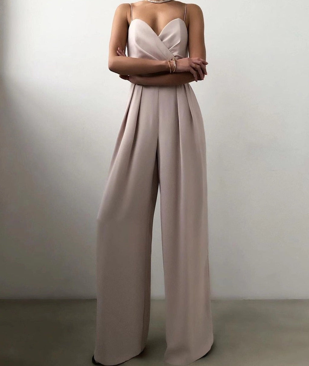 Pale apricot jumpsuit with long wide legs.
