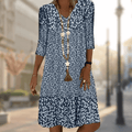 Blue floral V-neck dress with three-quarter sleeves and a gathered lower tier.