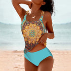 Mandala-print tankini top with slim straps and blue briefs.