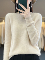 Pale cream jumper shown from the front with ribbed cuffs.