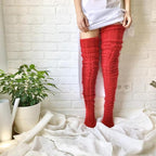 Red thigh-high socks with horizontal raised knit rows.