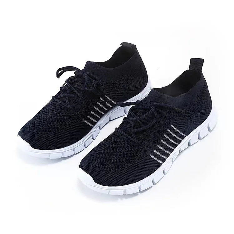 Dark navy trainers with striped side details and rear pull tabs.