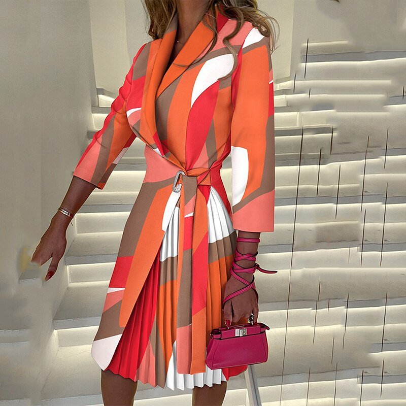 Orange abstract-print blazer dress with a contrasting pleated panel.