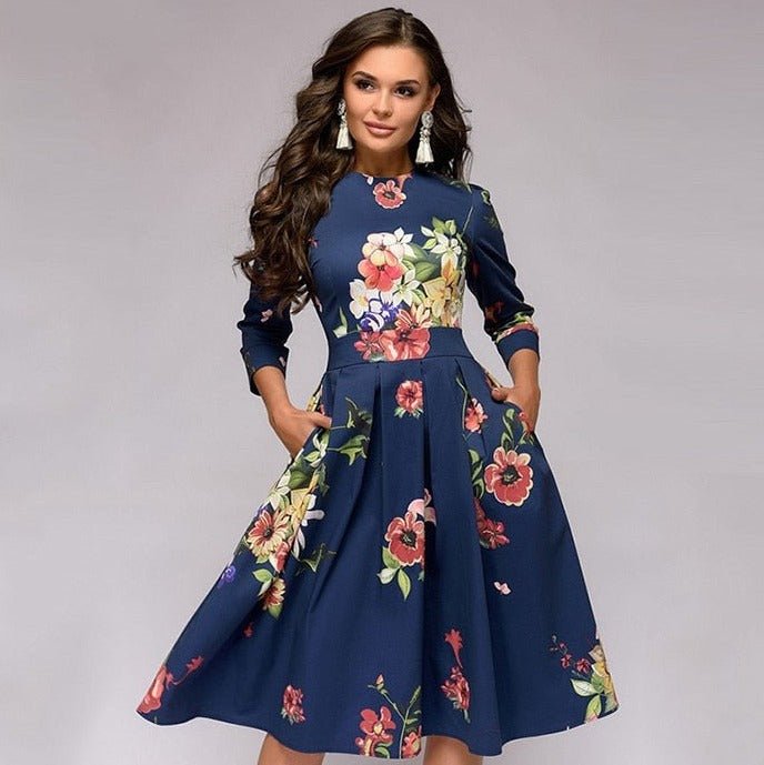 Navy dress with large multicoloured flowers shown from the front.