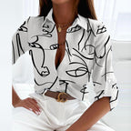 White blouse with black line-drawn faces.