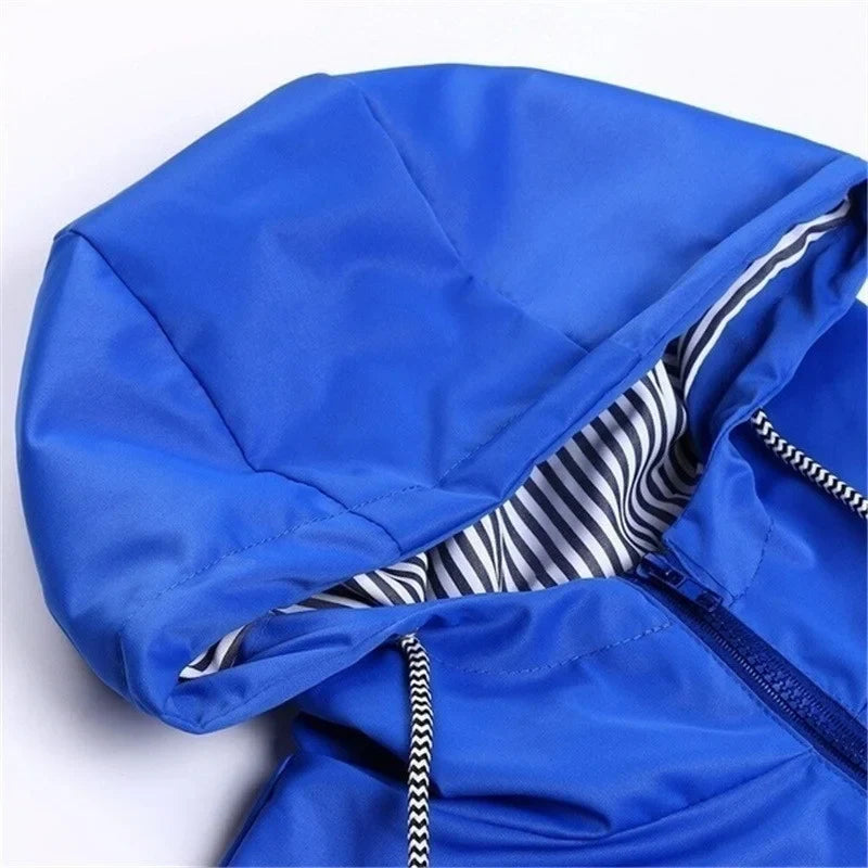 Close view of a blue hood showing its black-and-white striped lining.